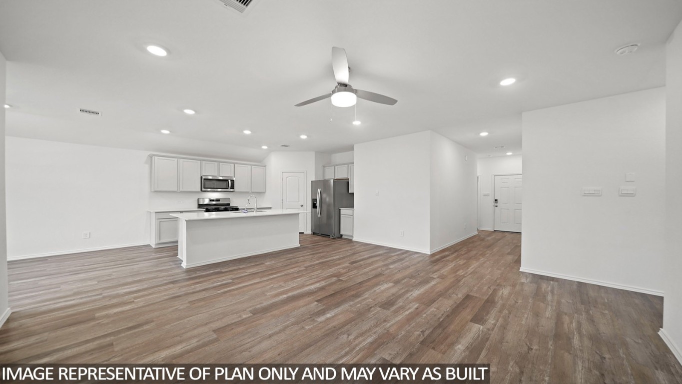 18330 Leibniz Road New Caney, TX 77357 - Photo 5 of 20 a view of kitchen with granite countertop cabinets and refrigerator