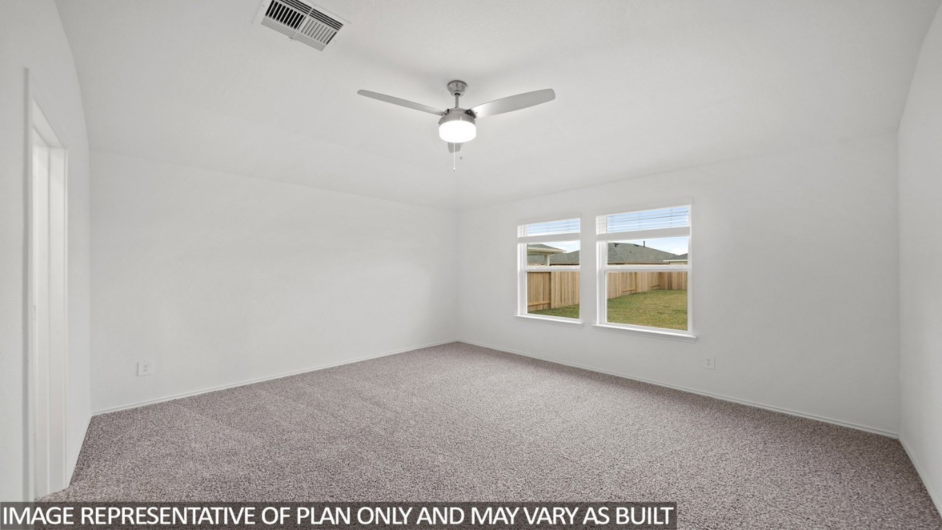 18330 Leibniz Road New Caney, TX 77357 - Photo 9 of 20 an empty room with windows and fan