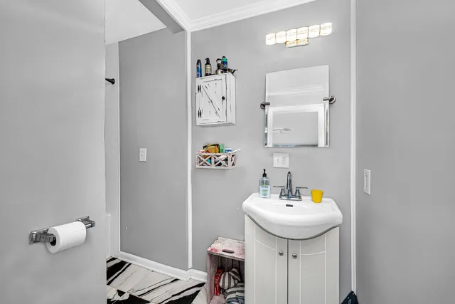 a bathroom with a sink and a mirror