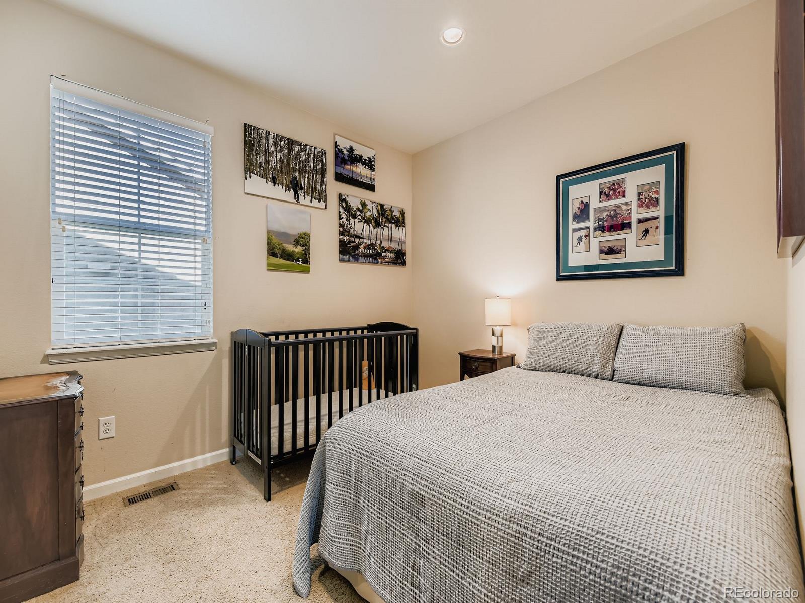 16545 Antero Circle Broomfield, CO 80023 - Photo 19 of 29 a bedroom with a bed and a window