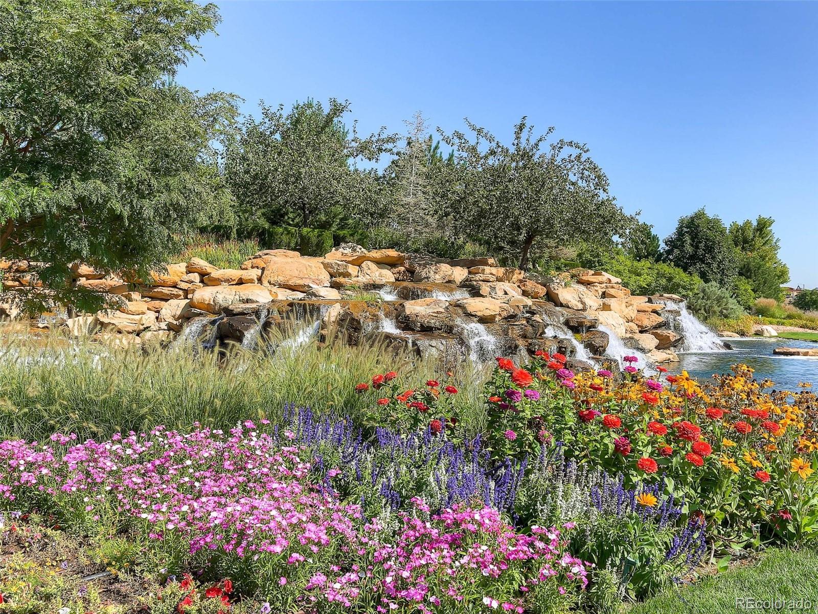 16545 Antero Circle Broomfield, CO 80023 - Photo 26 of 29 a view of a lake with a flower garden