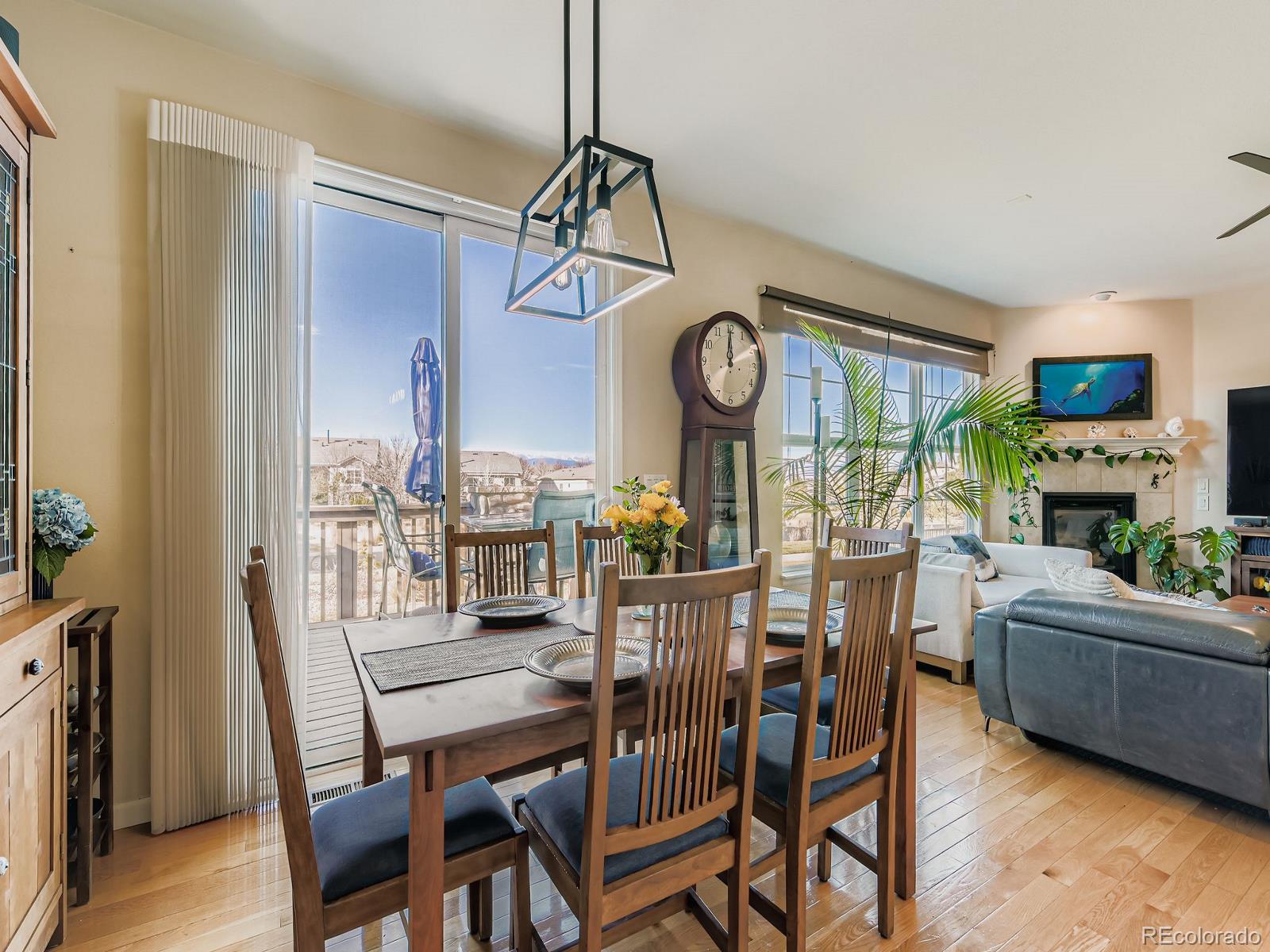 16545 Antero Circle Broomfield, CO 80023 - Photo 7 of 29 a view of a dining room with furniture and a clock
