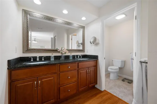 a bathroom with a shower a toilet and sink