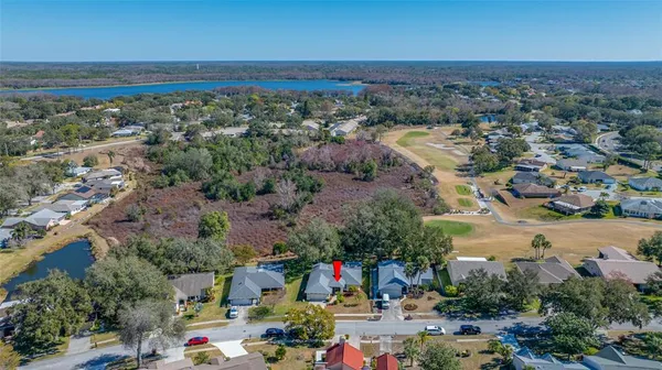an aerial view of a house with outdoor space