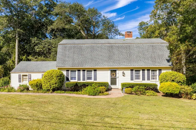 front view of a house with a yard