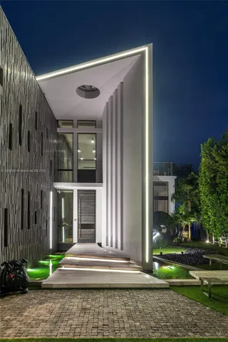 a living room with furniture a flat screen tv and a large window