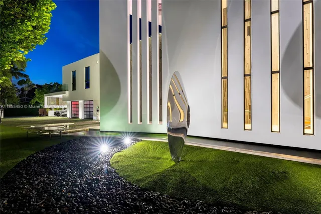 a living room with furniture kitchen view and a flat screen tv