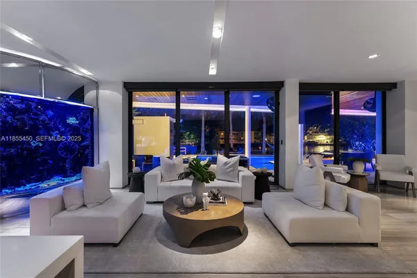 a bedroom with a bed and glass door
