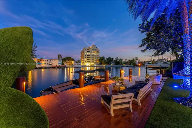 a view of a swimming pool with seating
