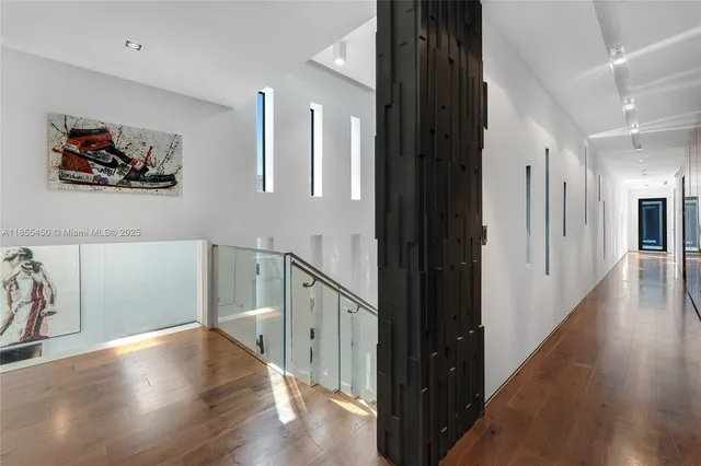 a bathroom with a sink mirror and shower