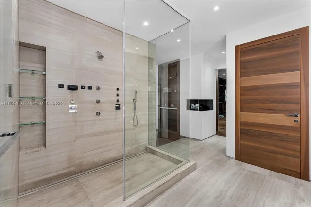 an aerial view of residential houses with outdoor space and lake view