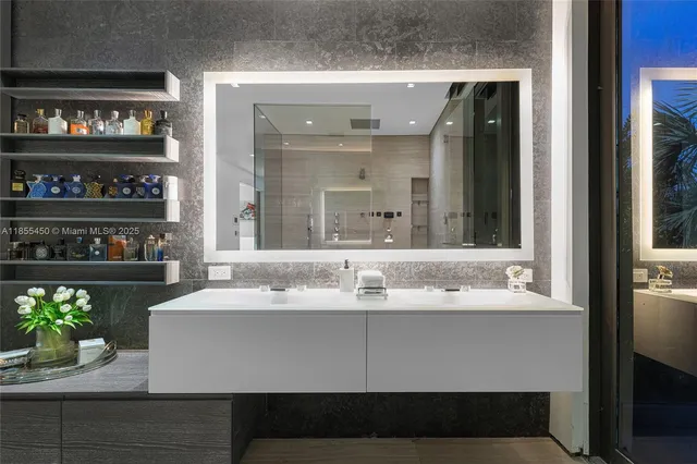 an aerial view of a house with a garden and lake view