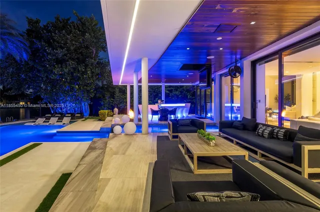 a view of swimming pool with outdoor seating