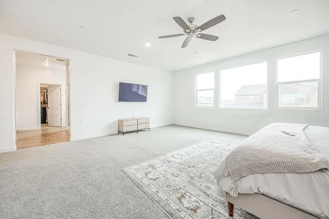 a bathroom with a shower sink and mirror