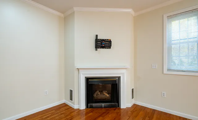 a room with a fireplace and a window