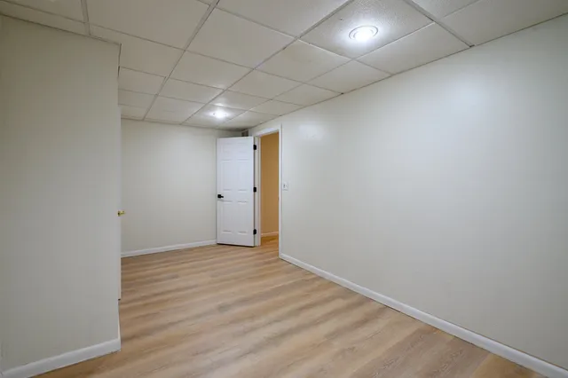 a view of hallway with an empty room