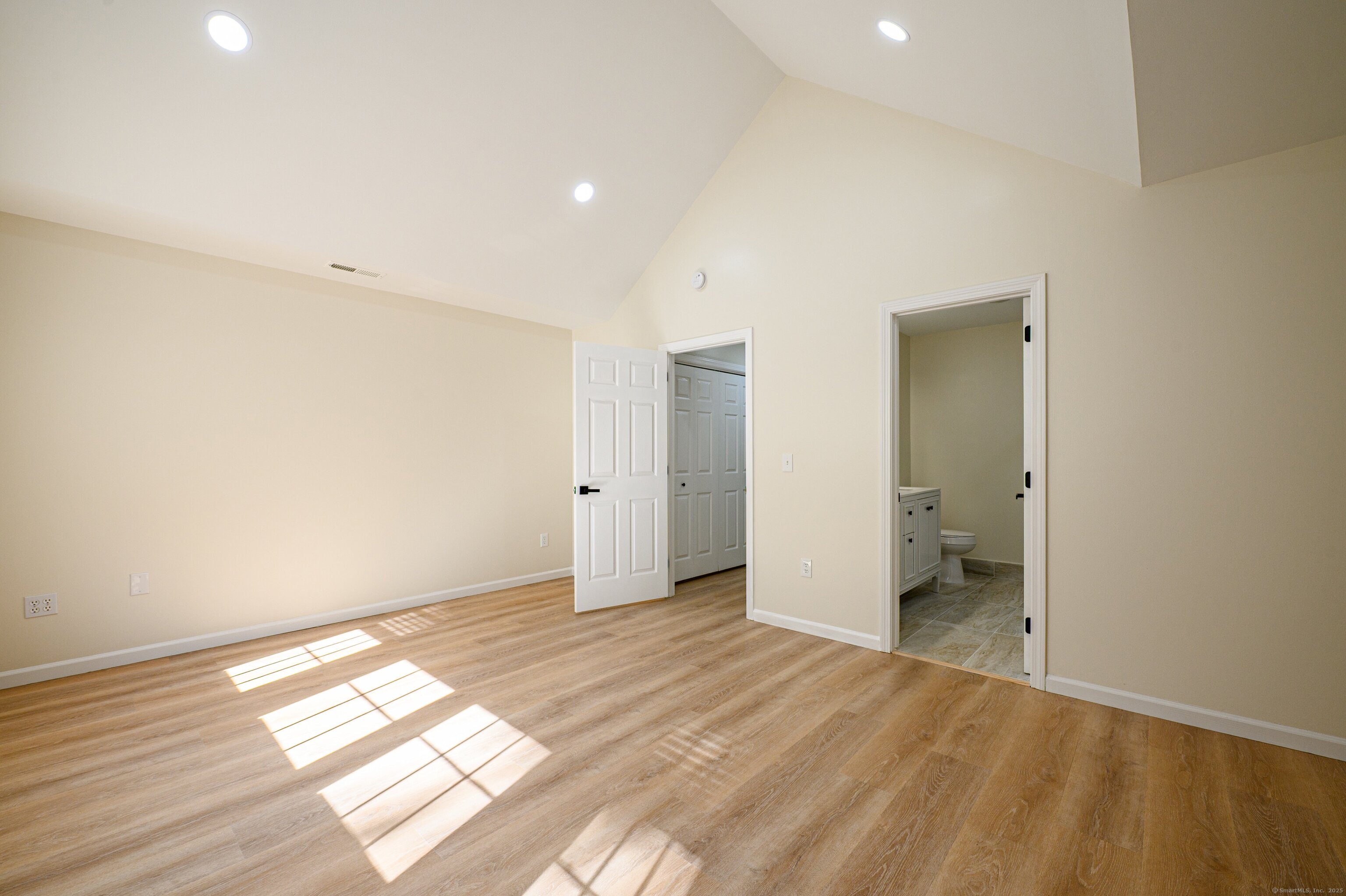 1 Munson Drive, Unit 3 Wallingford, CT 06492 - Photo 27 of 38 a view of empty room with wooden floor