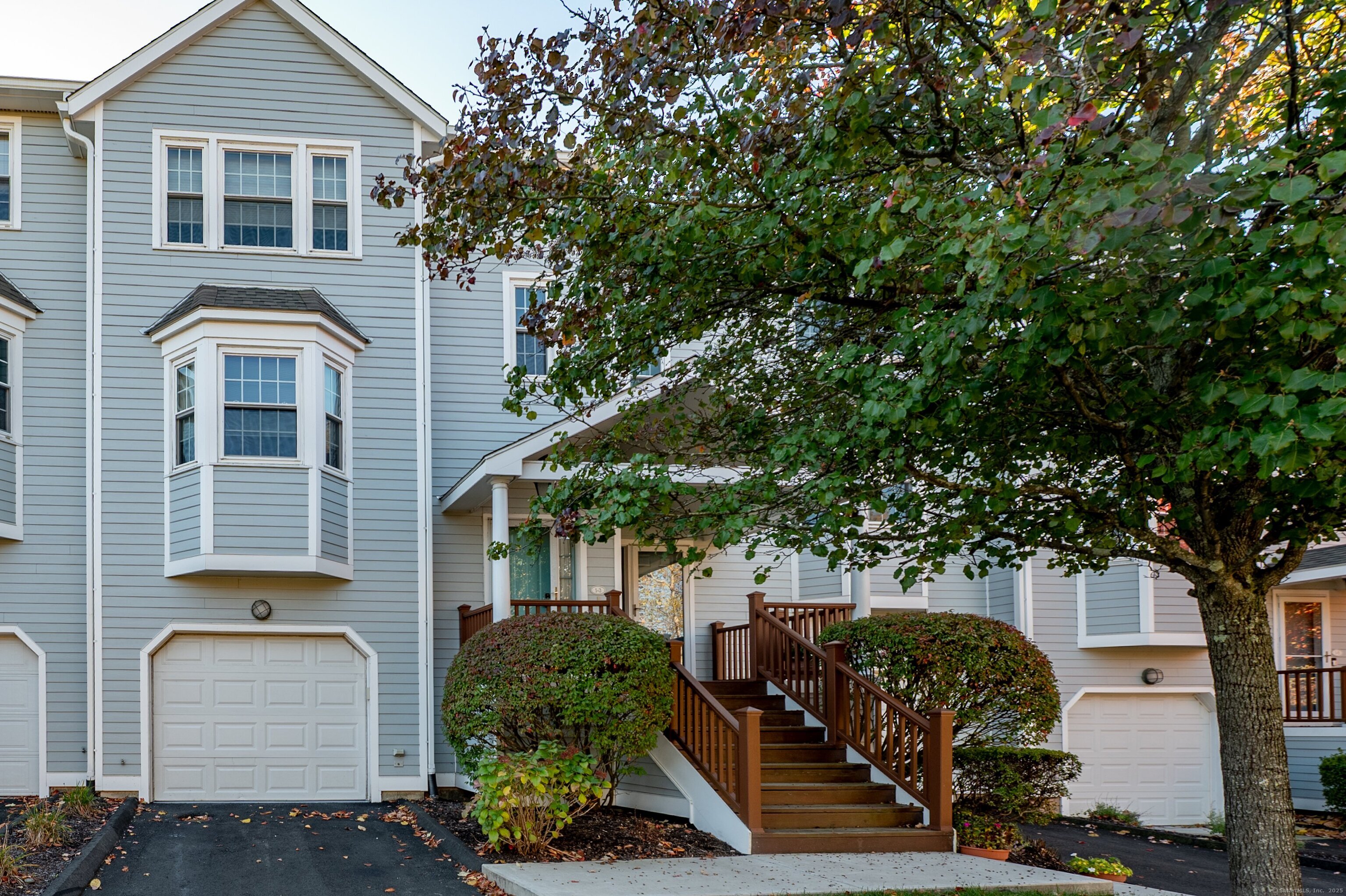 1 Munson Drive, Unit 3 Wallingford, CT 06492 - Photo 3 of 38 a front view of a house with garden