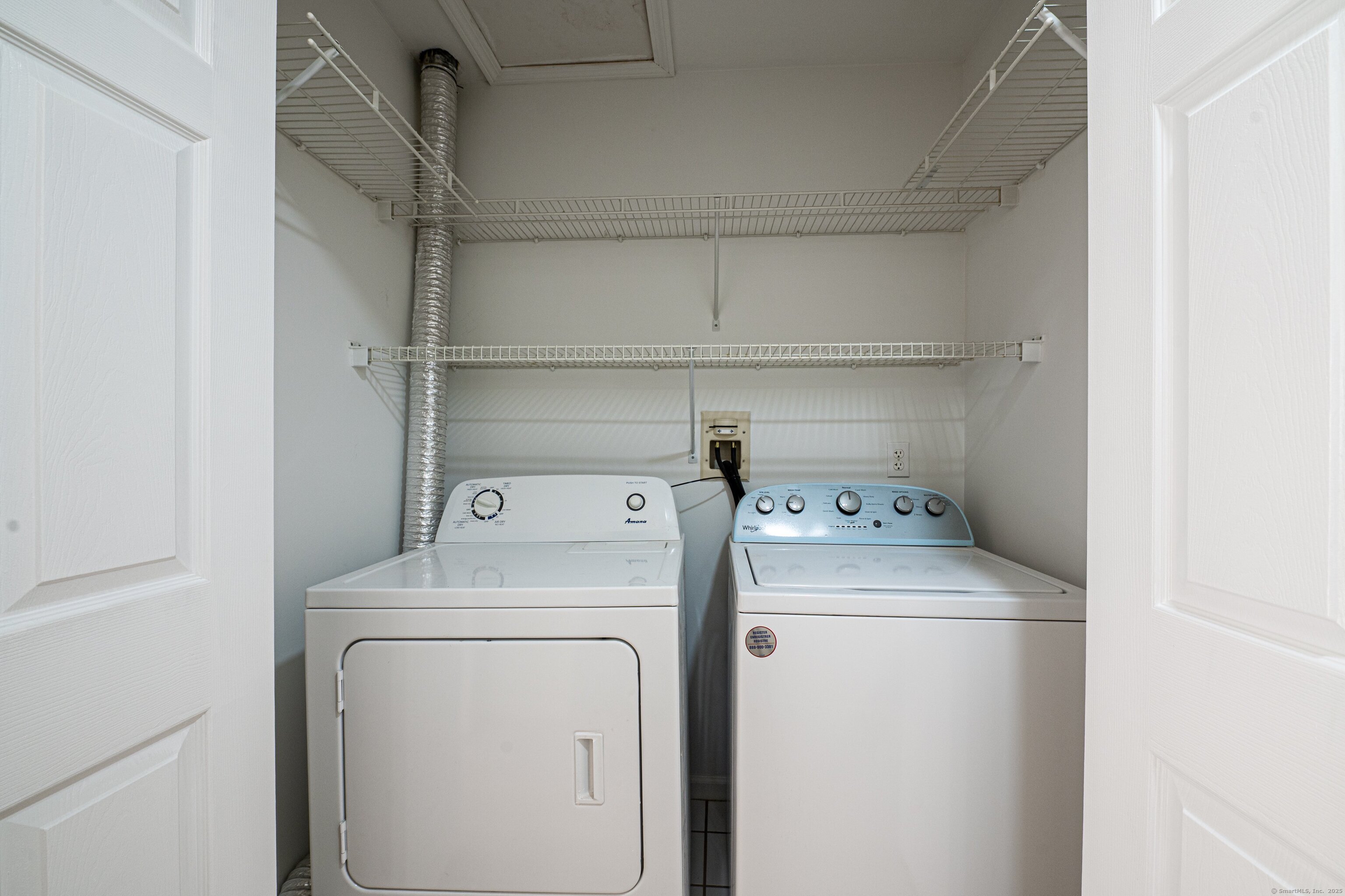 1 Munson Drive, Unit 3 Wallingford, CT 06492 - Photo 31 of 38 a view of storage and utility room with washer and dryer