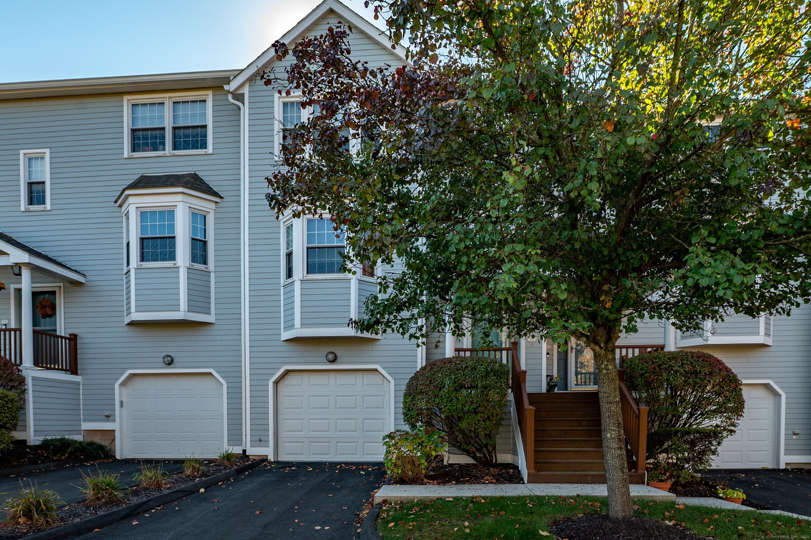 1 Munson Drive, Unit 3 Wallingford, CT 06492 - Photo 6 of 38 a front view of a house with garden