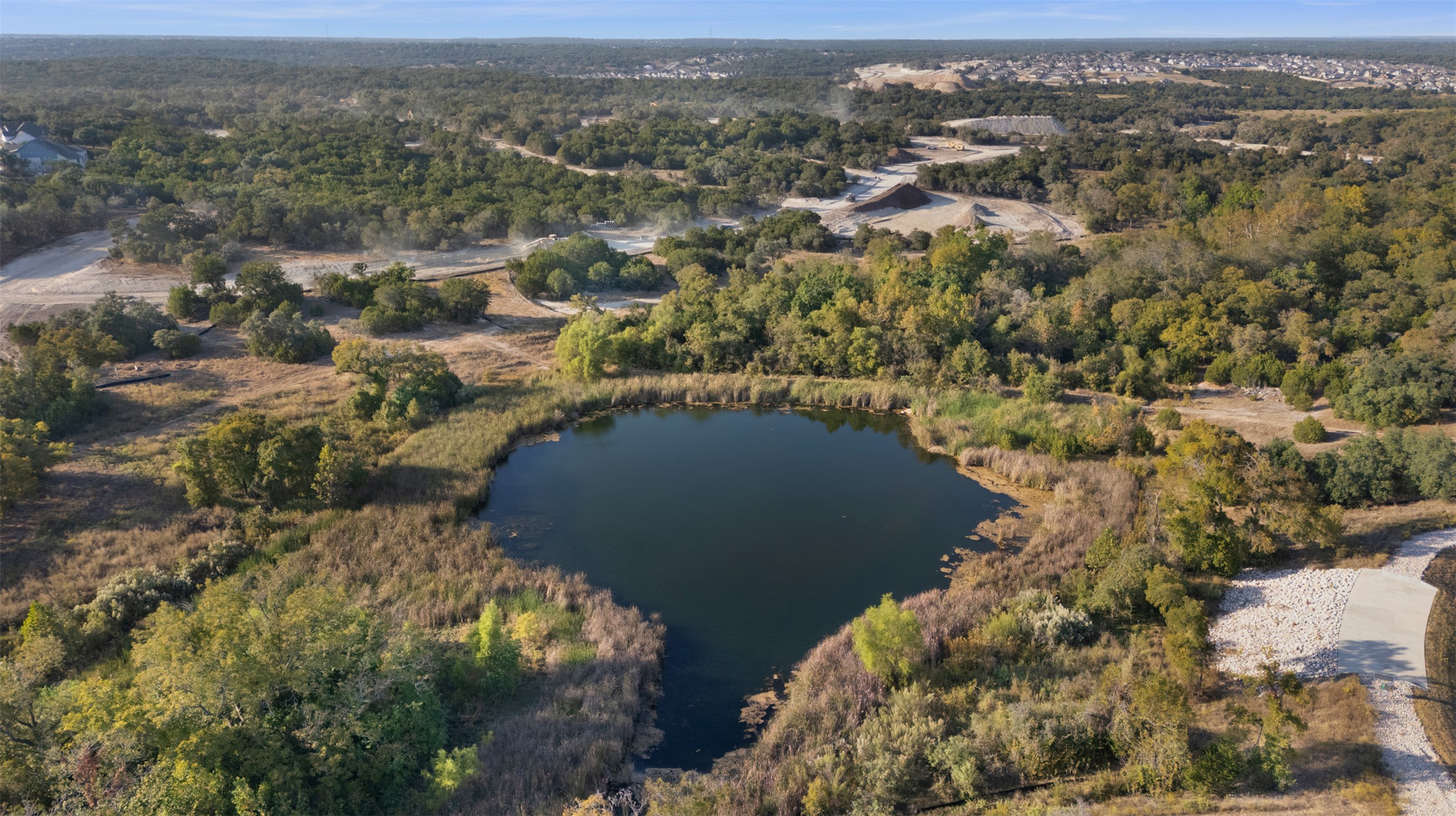1129 Pansy Trail Georgetown, TX 78628 - Photo 29 of 29 Aerial overview of property's location featuring a heavily wooded area and a large body of water