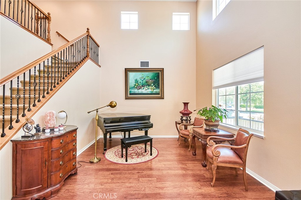 12430 Split Rein Drive Rancho Cucamonga, CA 91739 - Photo 11 of 29 a dining room with furniture entryway and wooden floor