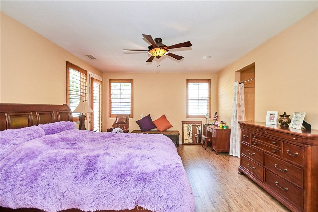 12430 Split Rein Drive Rancho Cucamonga, CA 91739 - Photo 16 of 29 a bed room with a bed and a dresser