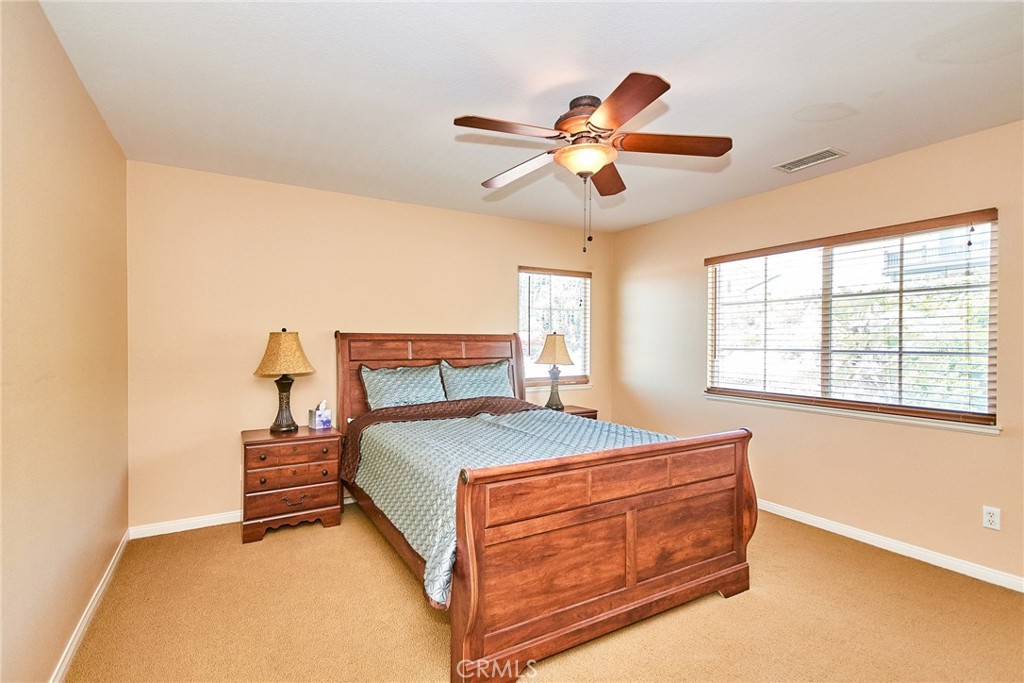 12430 Split Rein Drive Rancho Cucamonga, CA 91739 - Photo 18 of 29 a bedroom with a bed and window