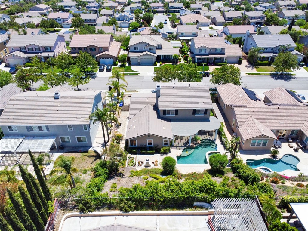 12430 Split Rein Drive Rancho Cucamonga, CA 91739 - Photo 28 of 29 an aerial view of multiple houses with yard