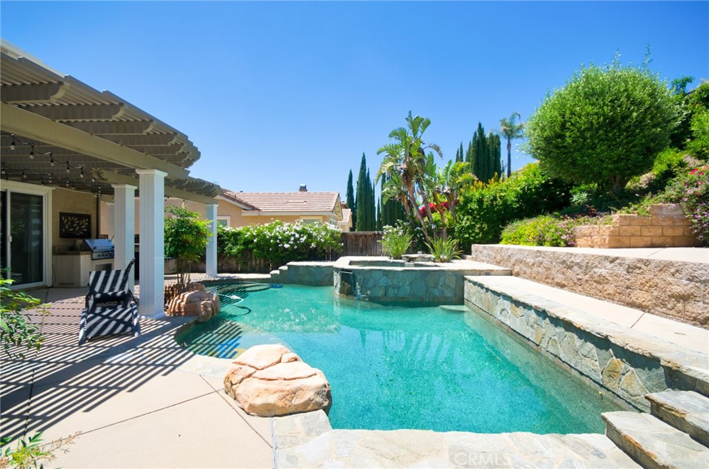 12430 Split Rein Drive Rancho Cucamonga, CA 91739 - Photo 8 of 29 a view of a backyard with plants and a patio