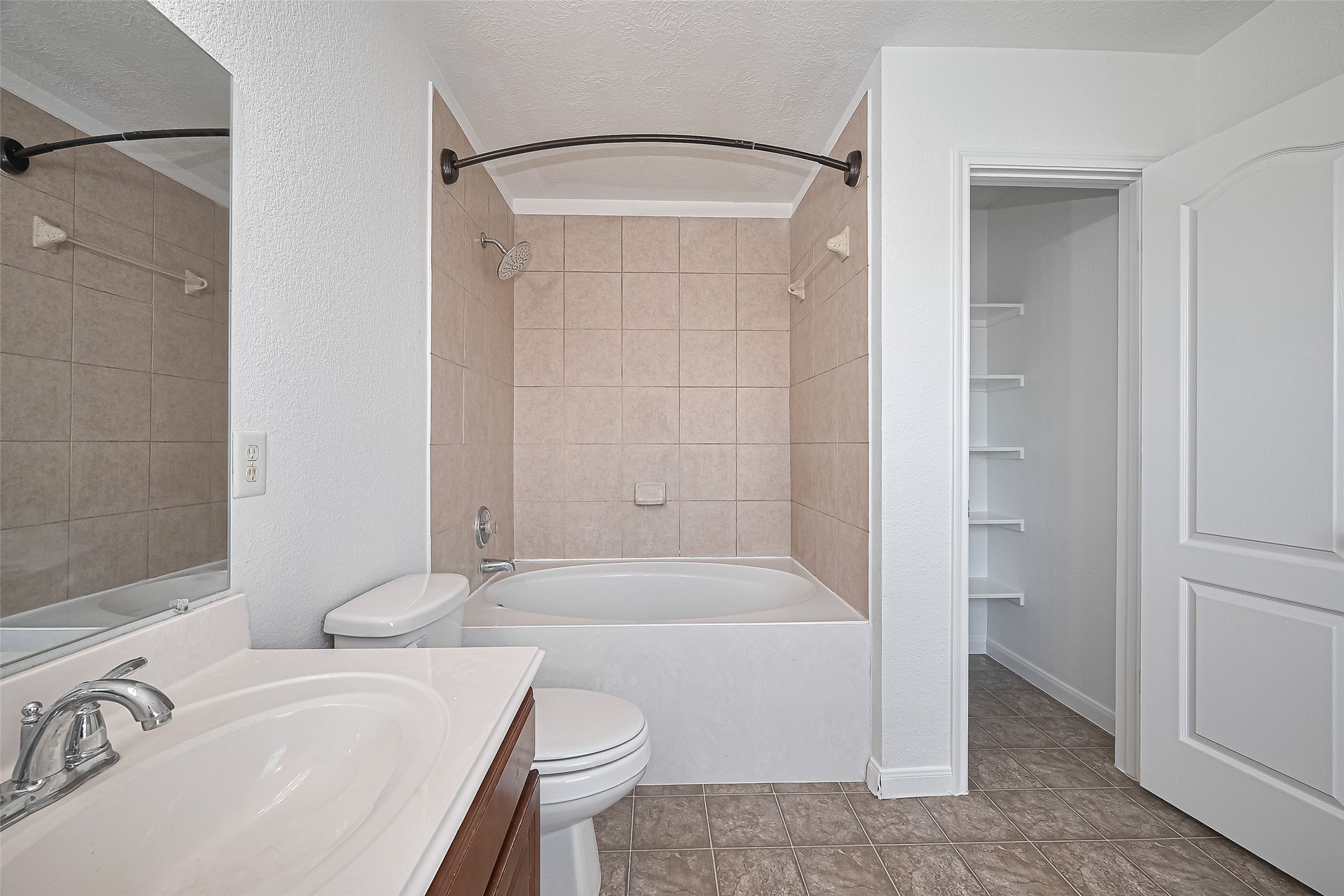 7734 Pasture Bend Lane Cypress, TX 77433 - Photo 45 of 50 a bathroom with a granite countertop sink toilet and shower