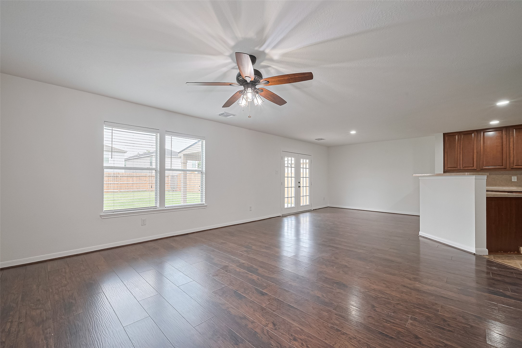 7734 Pasture Bend Lane Cypress, TX 77433 - Photo 6 of 50 a view of empty room with wooden floor and fan