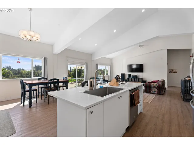 a bathroom with a sink toilet a mirror and shower