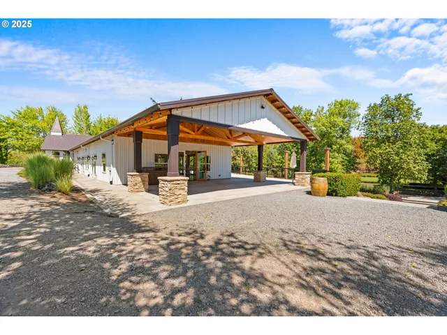a view of a dining room with furniture wooden floor and a chandelier
