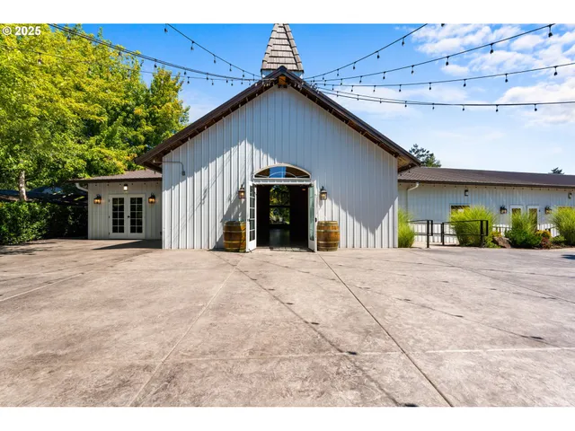 a room with lots of wooden furniture and a chandelier