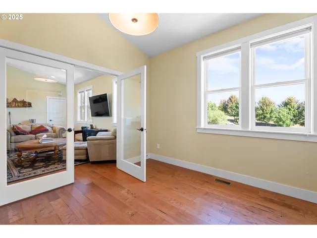 a view of living room filled with furniture and window