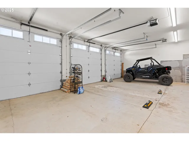 a view of a garage with parked cars