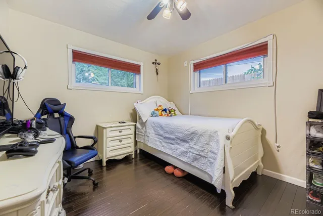 a bedroom with a bed and a view of workspace