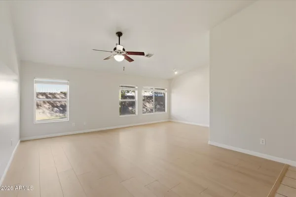 a view of an empty room with a window