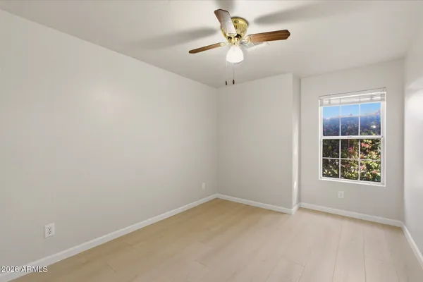 a bedroom with bed and a couch