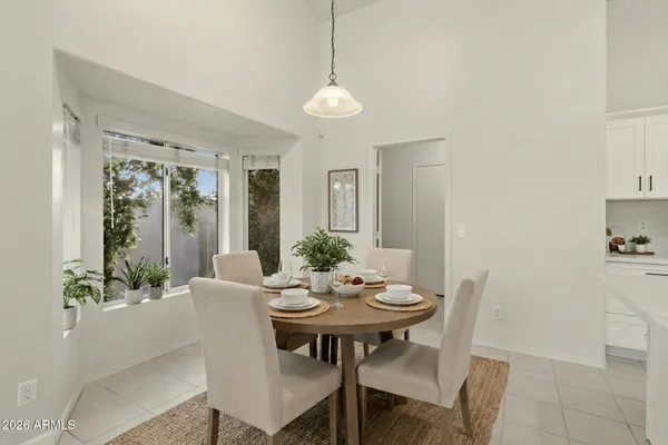a view of a dining room with furniture window and outside view
