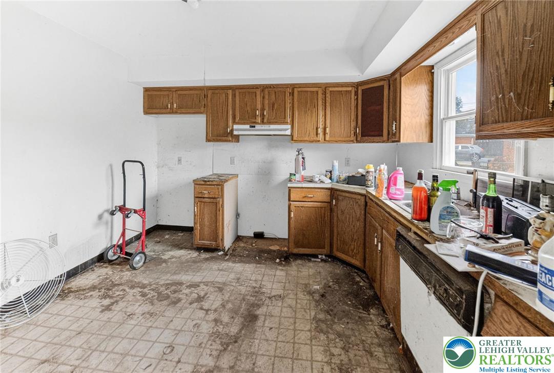 708 Cherokee Street Bethlehem, PA 18015 - Photo 6 of 18 a kitchen with a sink cabinets and appliances
