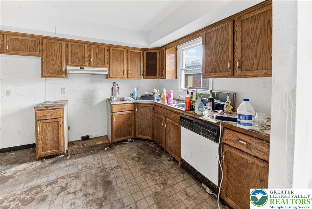 708 Cherokee Street Bethlehem, PA 18015 - Photo 7 of 18 a kitchen with a sink cabinets and window