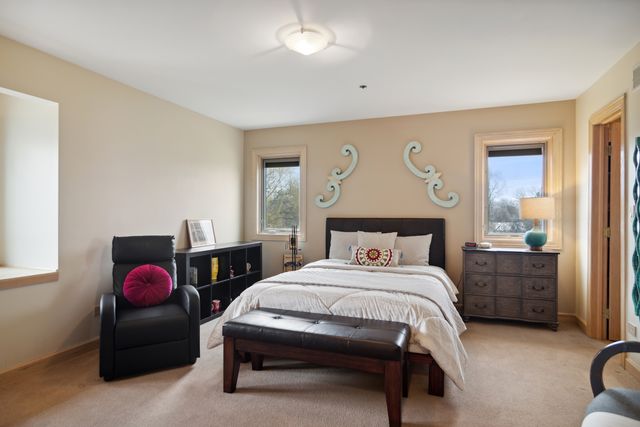 a bedroom with a bed and window