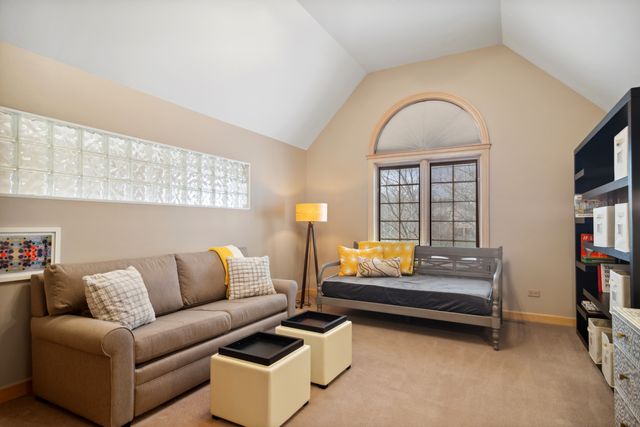 a bedroom with furniture and a book shelf