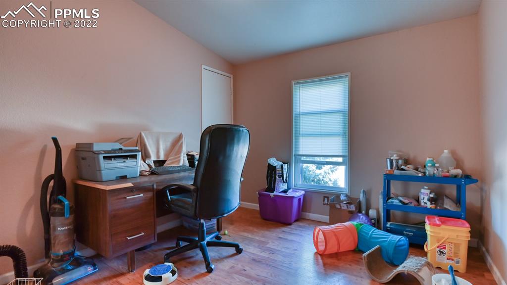 34475 East Jones Road Yoder, CO 80864 - Photo 19 of 37 a view of a workspace with furniture and a window