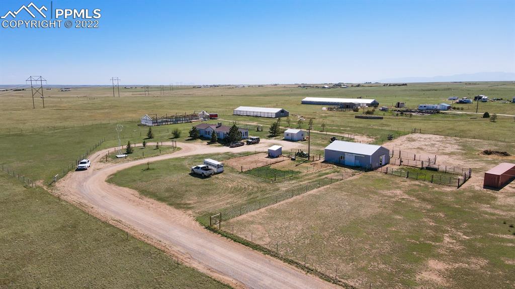 34475 East Jones Road Yoder, CO 80864 - Photo 26 of 37 a view of a lake with lawn chairs