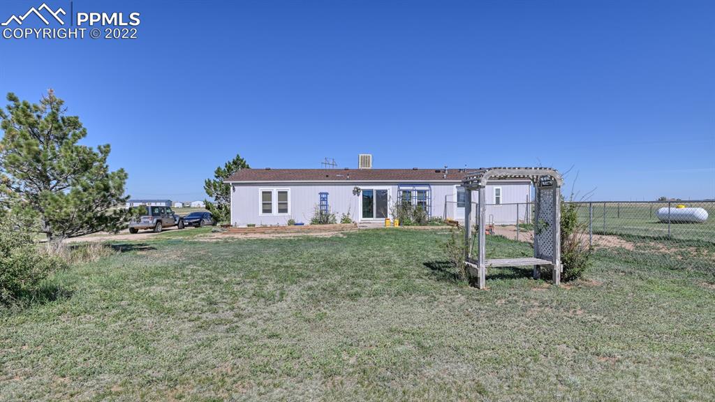 34475 East Jones Road Yoder, CO 80864 - Photo 33 of 37 a view of a house with a yard