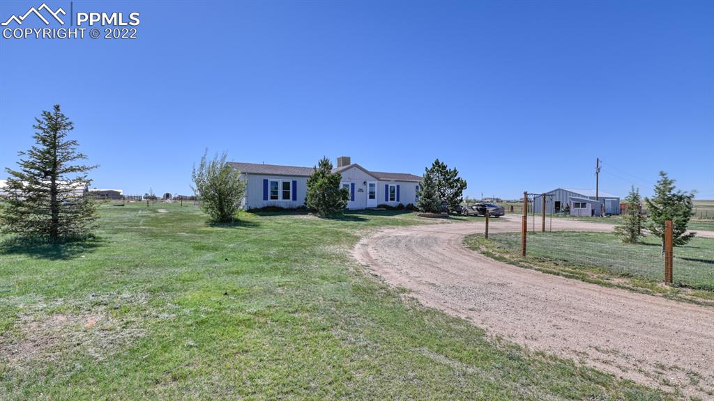 34475 East Jones Road Yoder, CO 80864 - Photo 35 of 37 a view of a house with a yard