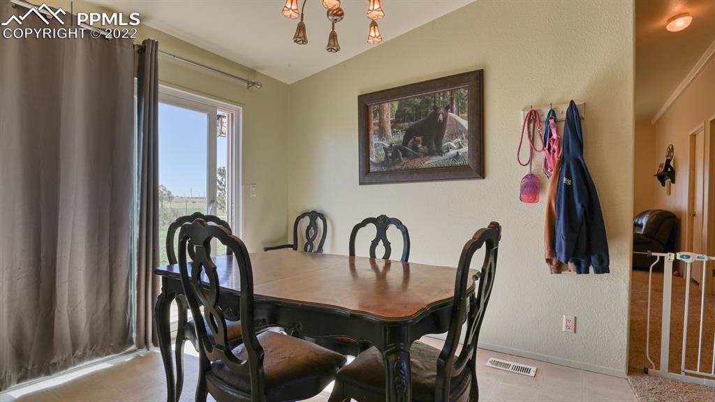 34475 East Jones Road Yoder, CO 80864 - Photo 10 of 37 a view of a dining room with furniture and window
